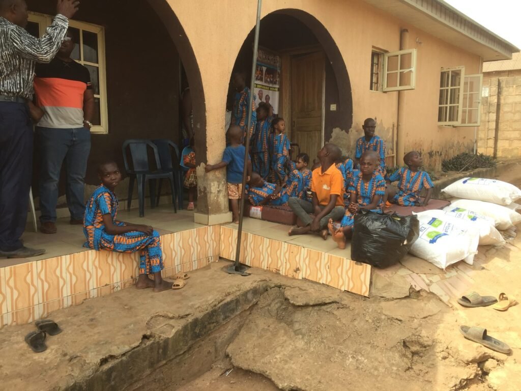 Children at Heaven's Nest orphanage in Nigeria with bags of food, 2018