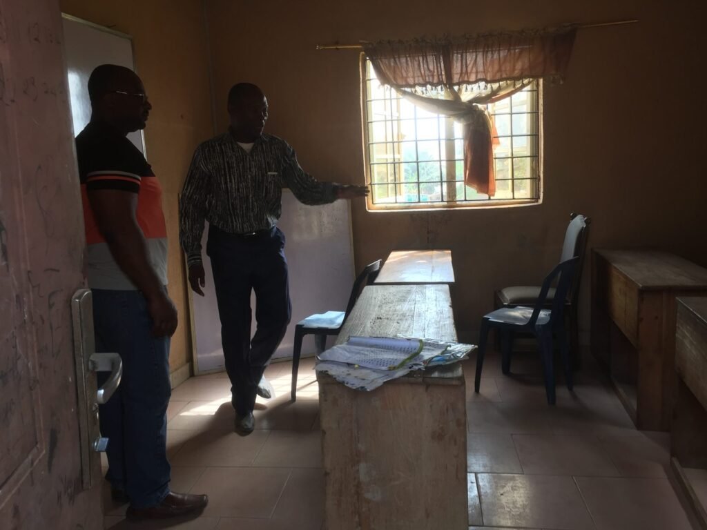 Education in Nigeria: a room with desks, chairs and a whiteboard, 2018